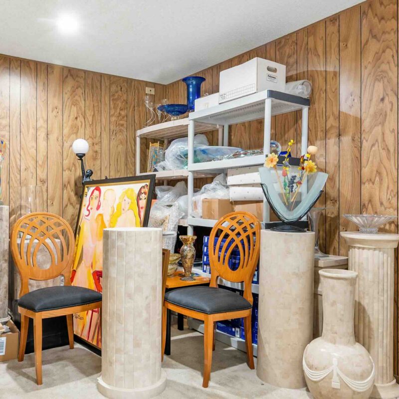 Photo of a messy basement prior to a clean out project.
