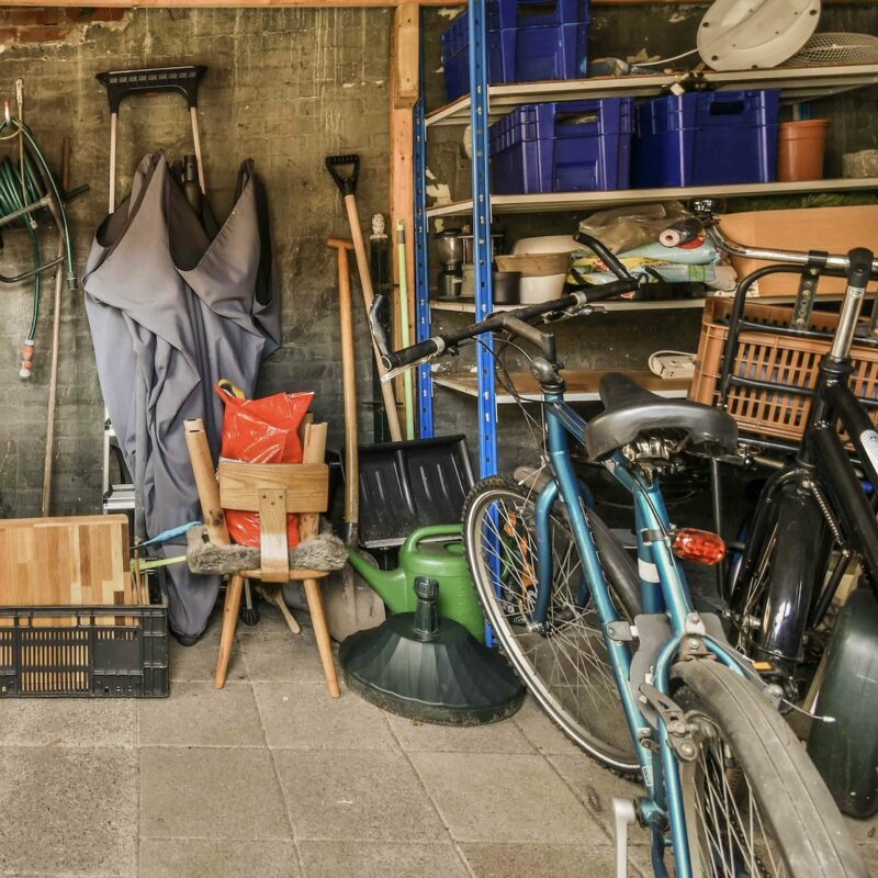 A photo of a garage cleanout in Des Moines, IA, needing a dumpster rental from Morgan Oaks Roll Offs to assist with the cleanup process.